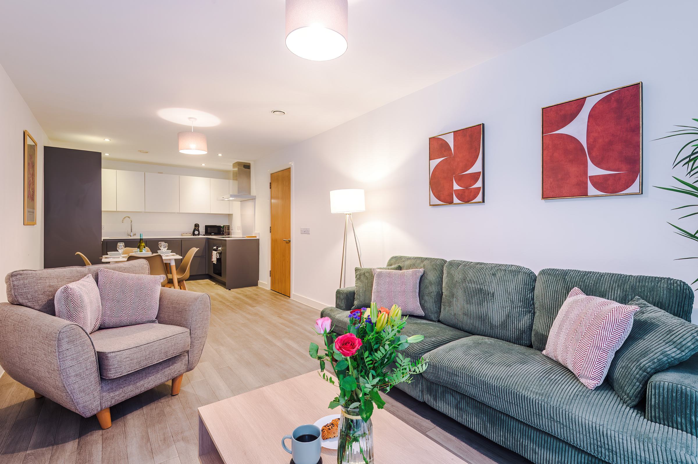 Open-plan living and kitchen area in a Hilltop serviced apartment